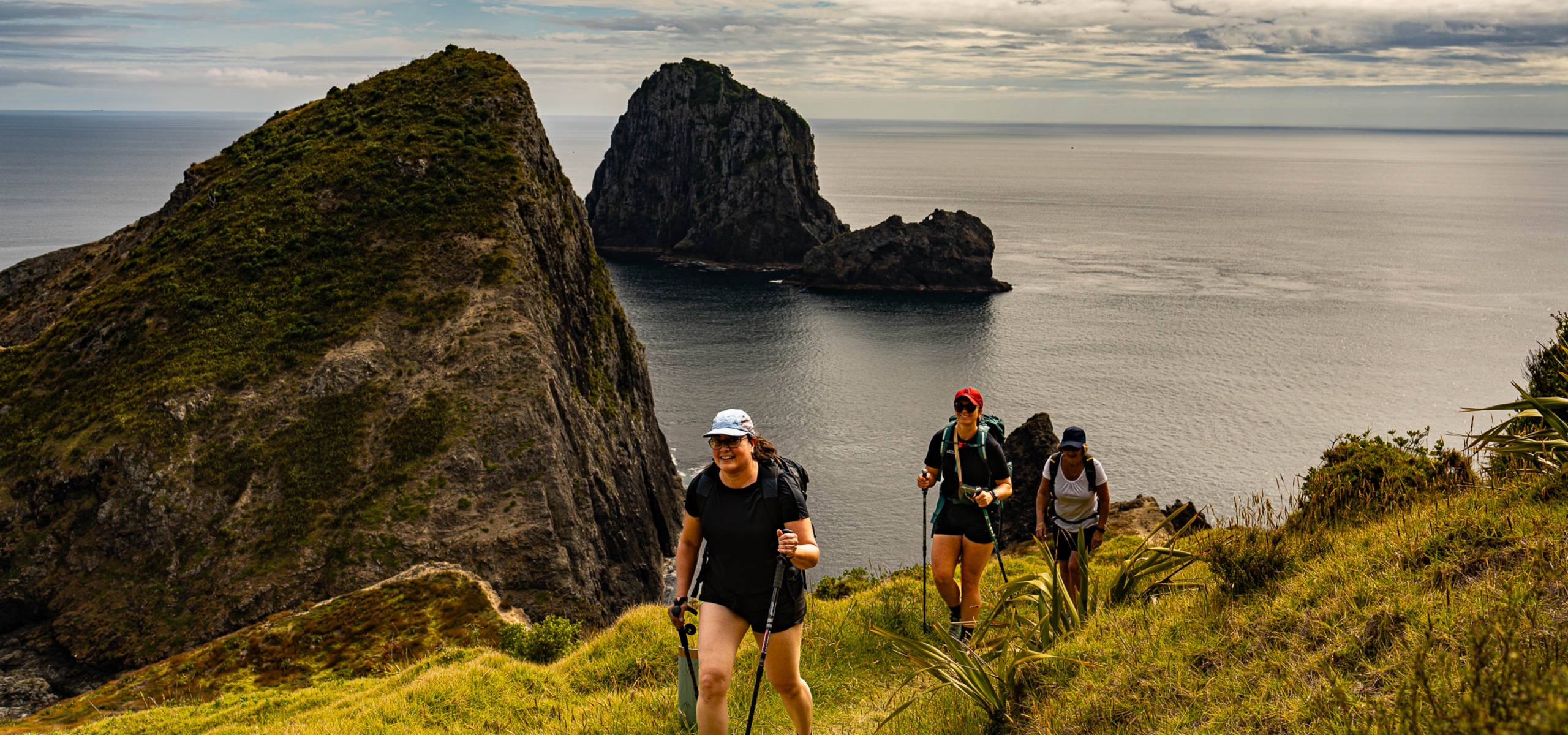 Active Adventures guide with guests on Northland Adventure at Mangawhai Heads