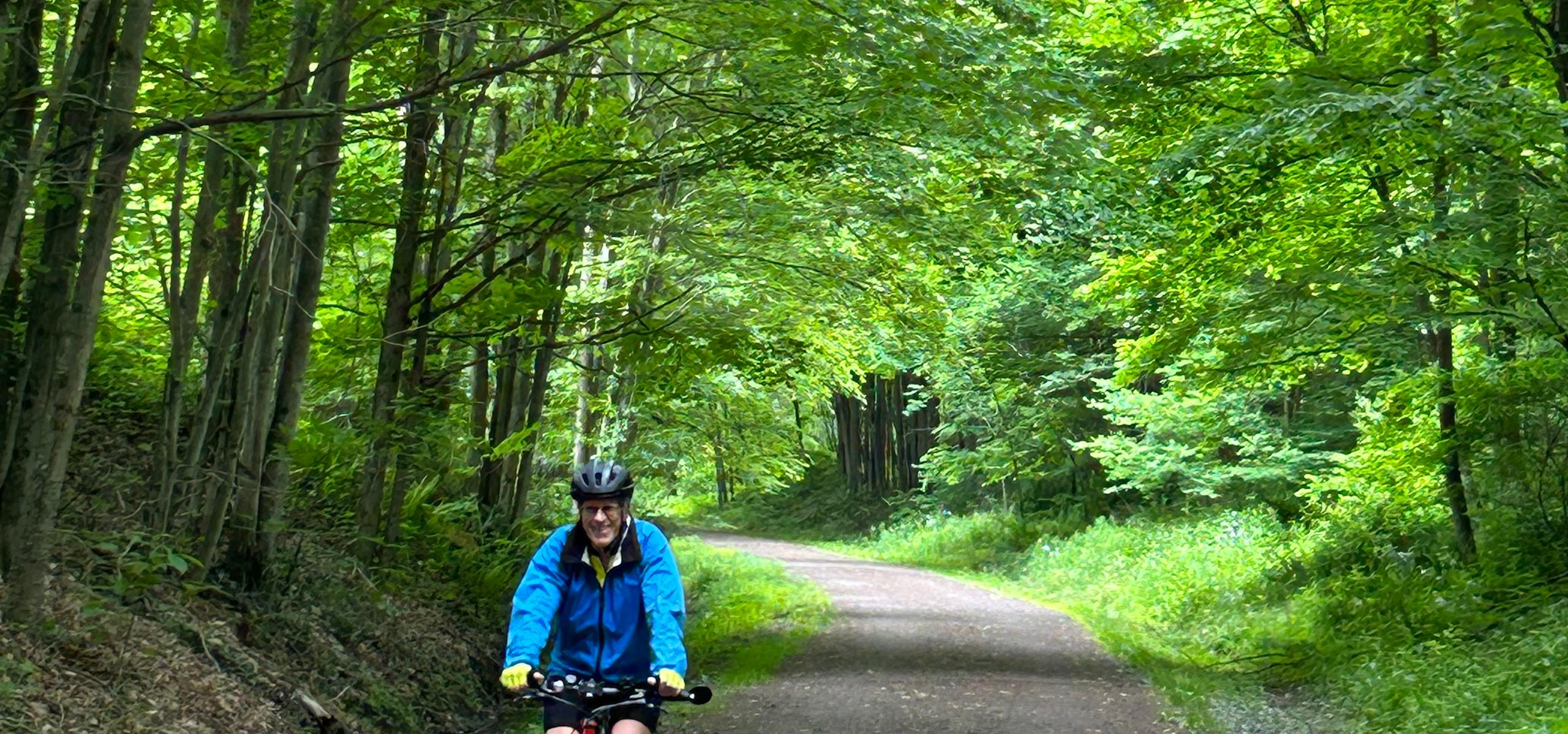 Guest cycling on the GAP trail bike tour