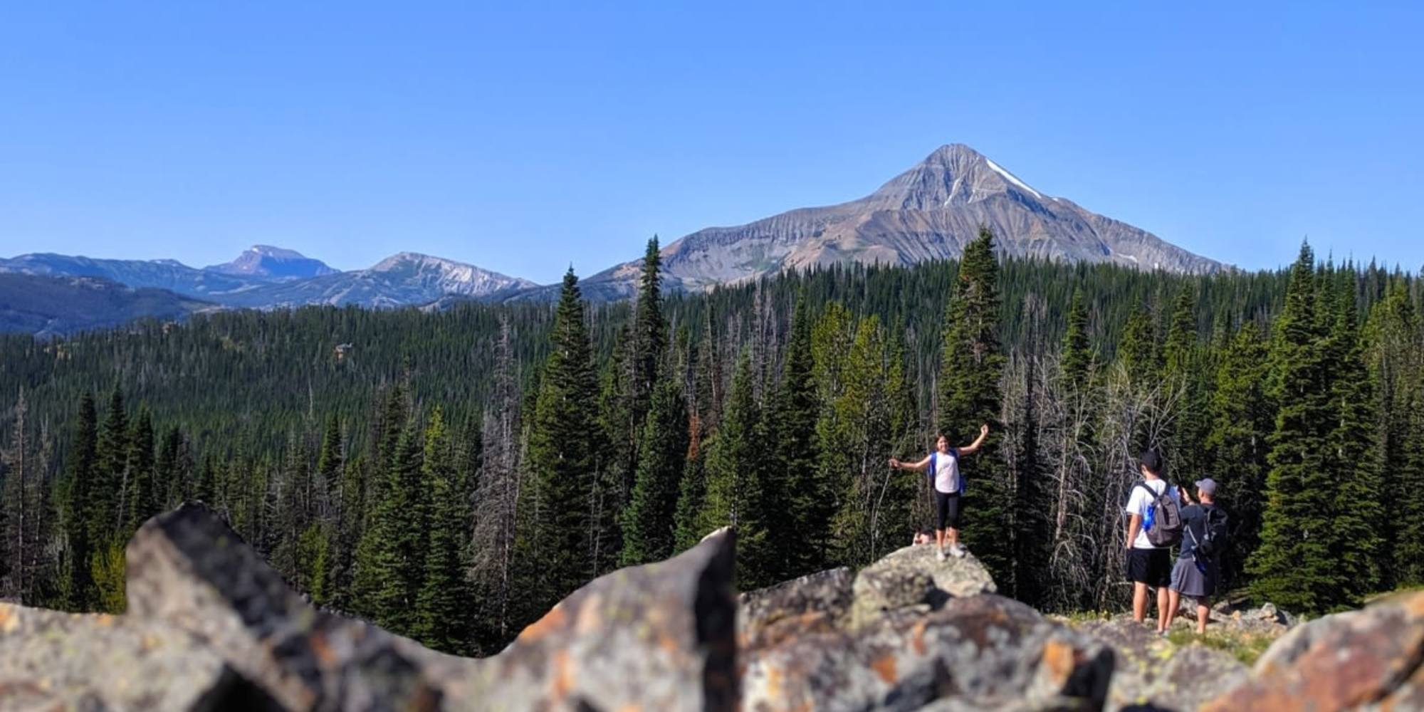 Guests hiking on their national park vacation in June