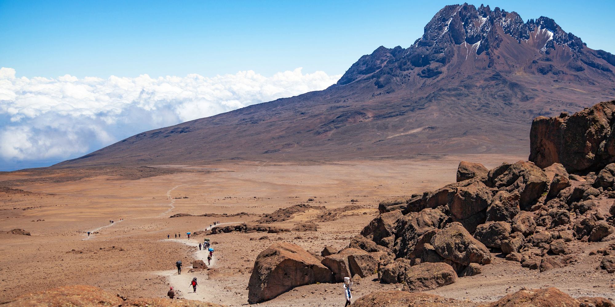 View of hikers walking towards Mawenzi Peak
