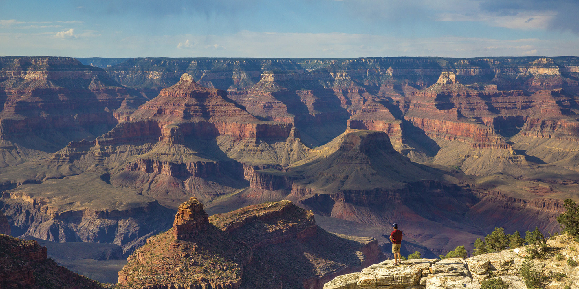 Grand Canyon Adventure hiker looking at view of Grand Canyon Arizona