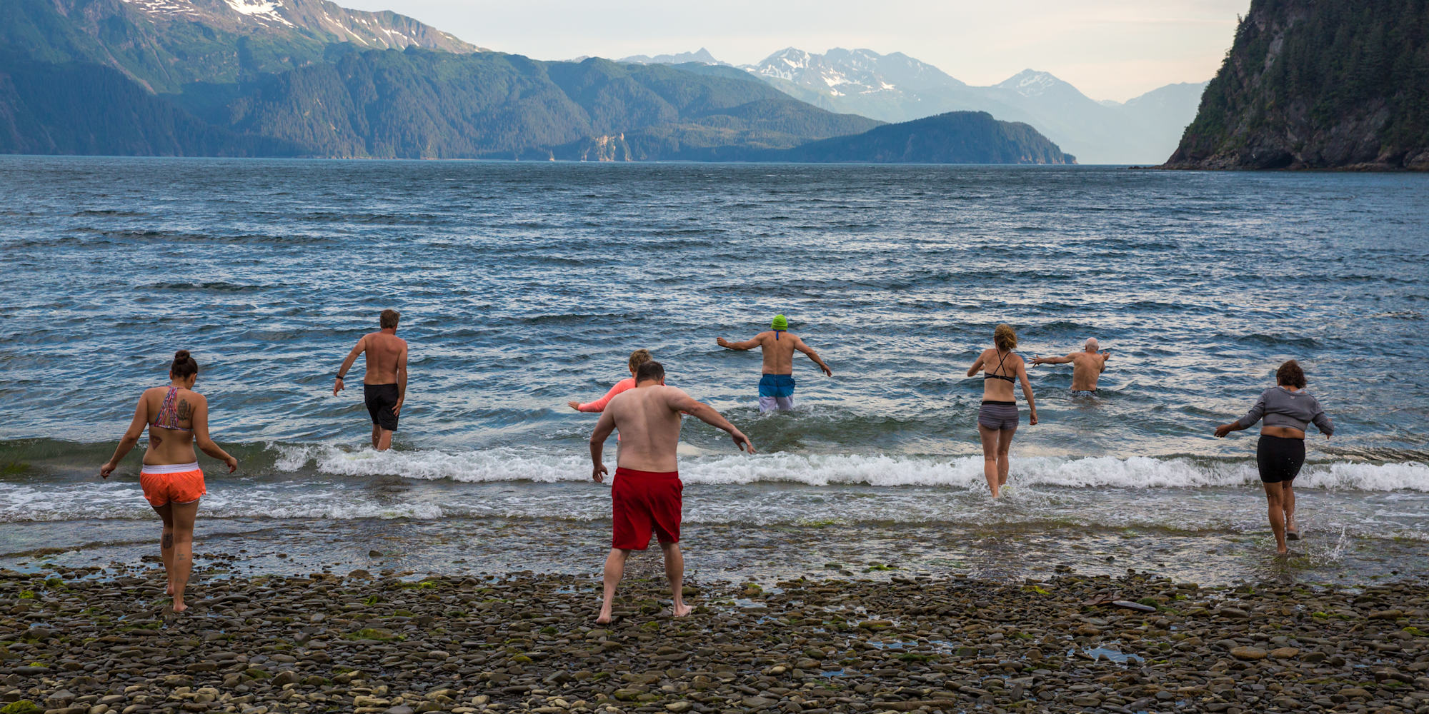 guests enjoying a swim in the sea in Kenai Fjords National Park