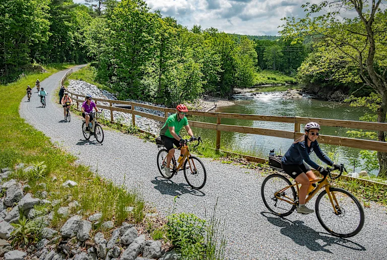 Discovery guests riding the Vermont rail trails bike tour in summer